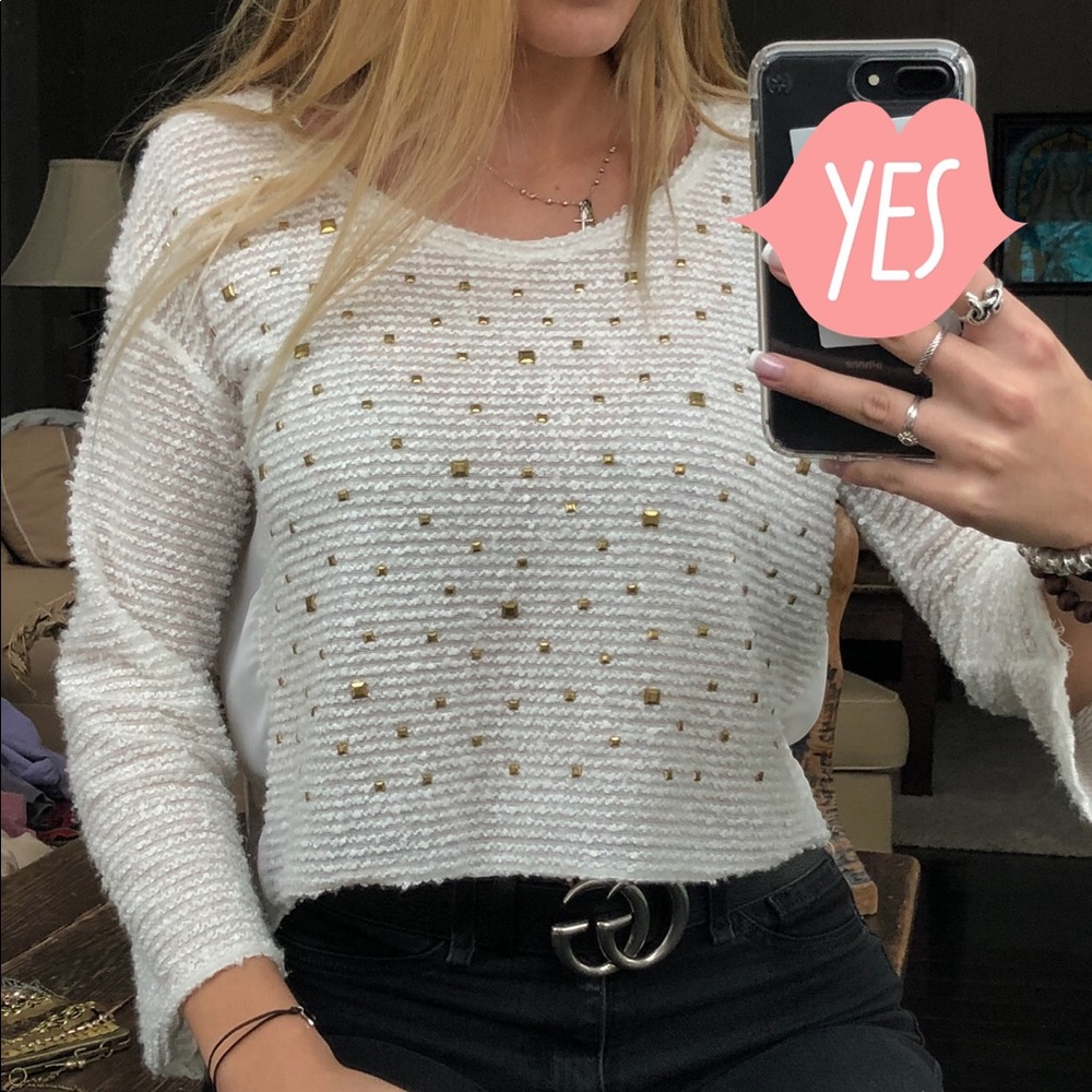 White crop top sweater with gold studs.